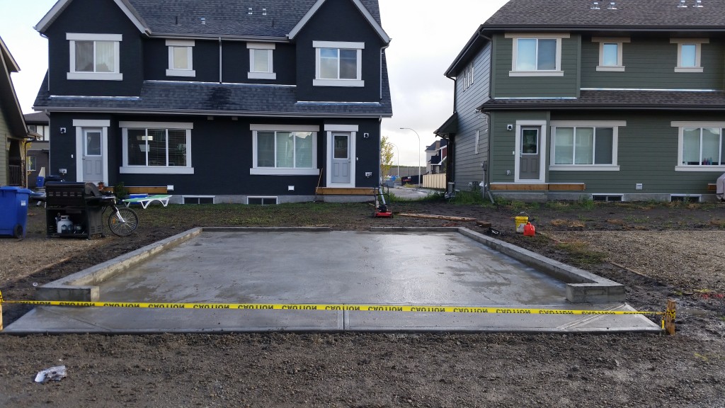 Concrete Garage Pad with Curb Wall Calgary